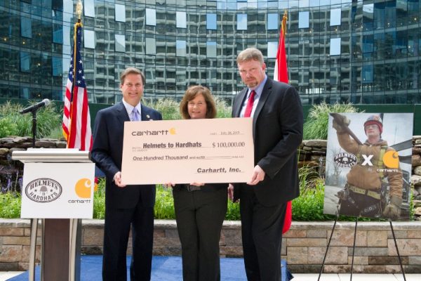 L to R- Congressman Donald Norcross, President and COO of Carhartt Linda Hubbard and Executive Director of Helmets to Hardhats Darrell Roberts (PRNewsFoto/Carhartt)