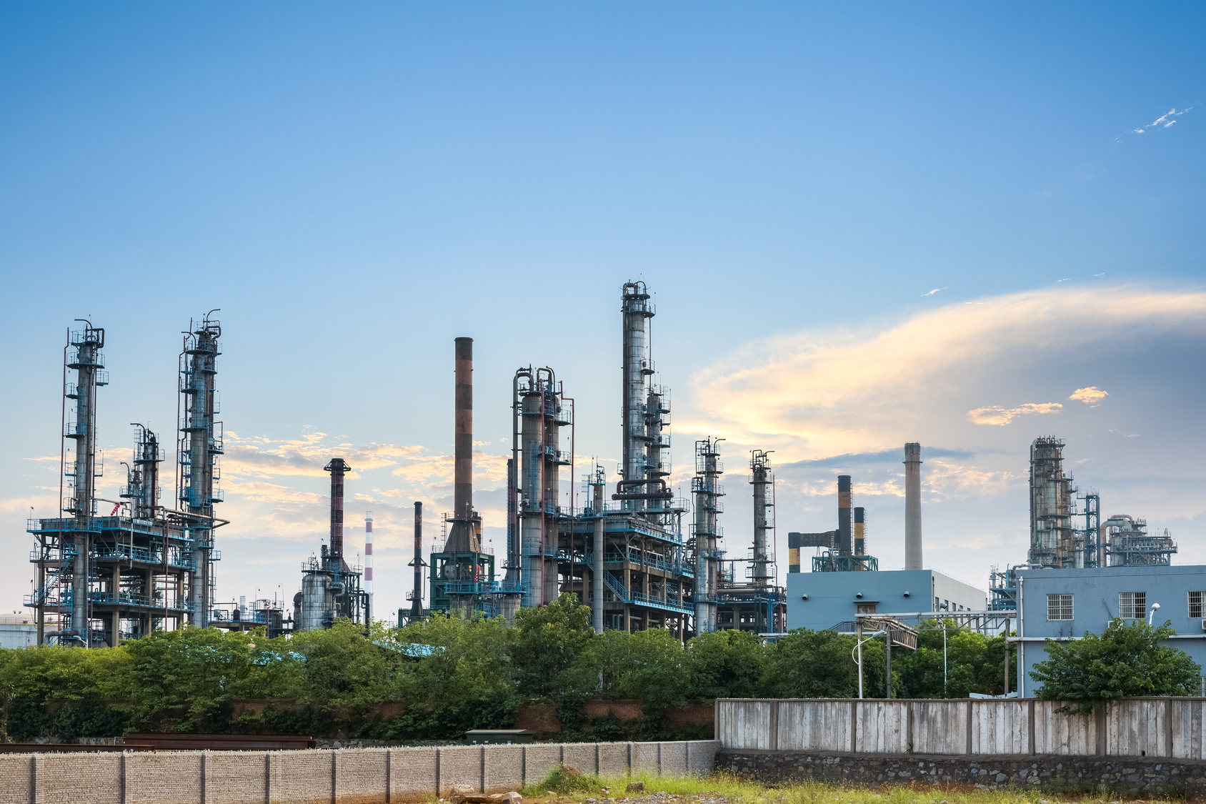 petrochemical plant skyline at dusk Littlegate Publishing