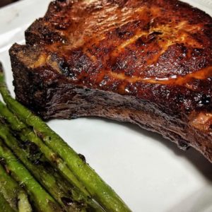 A close-up on a delicious-looking steak and asparagus