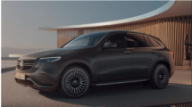 Mercedes Benz WQC 400 in black, with black alloys. Parked in front of a wooden clad building.