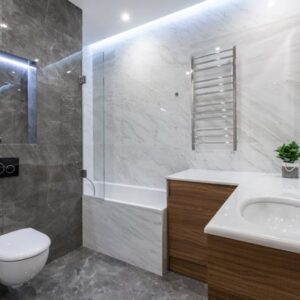 Image of luxurious contemporary bathroom with grey and white marble tiles and white bathroom fittings