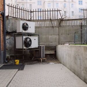 Image of outdoor air conditioning unit in urban industrial courtyard